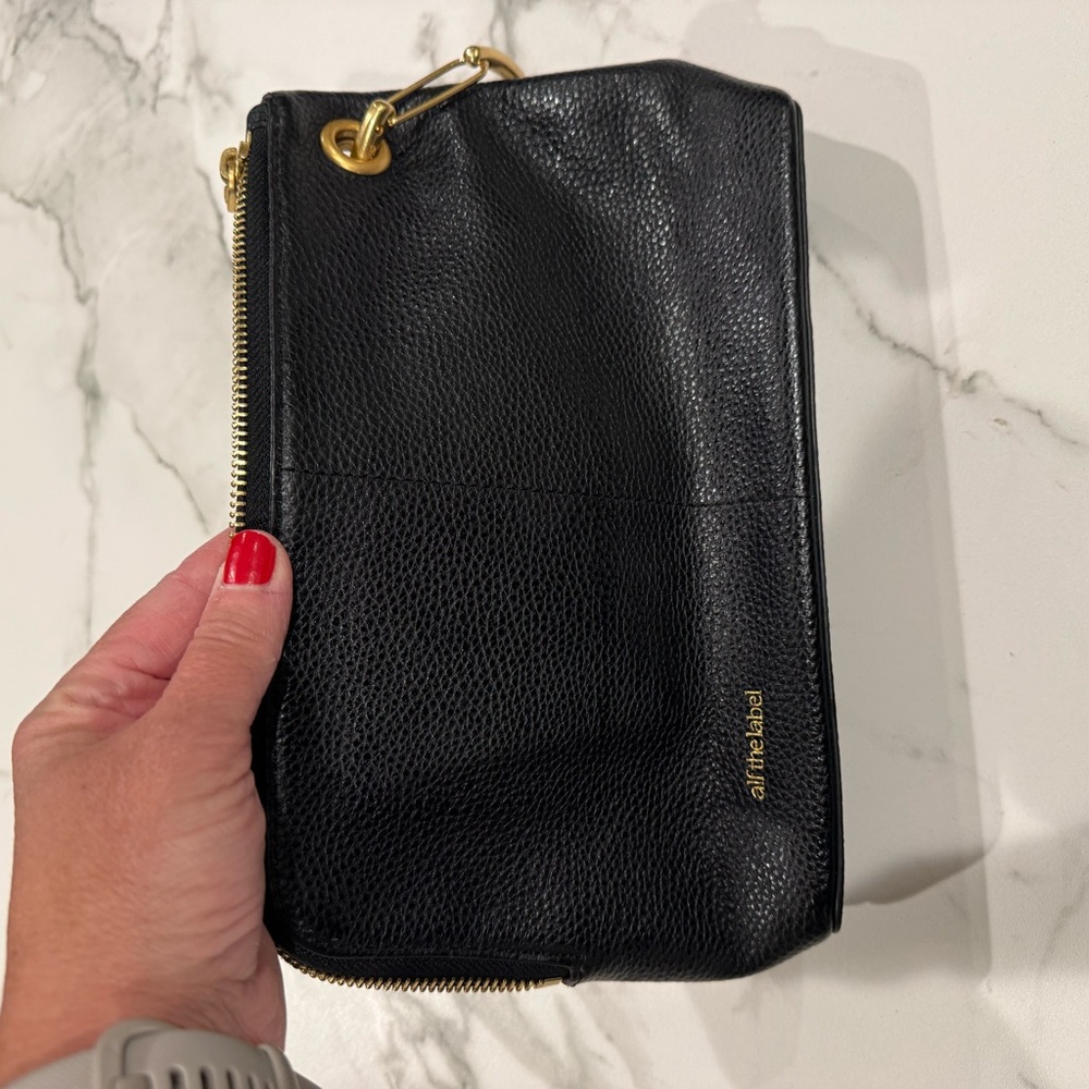 Chic Black Leather Wristlet with Gold Accents